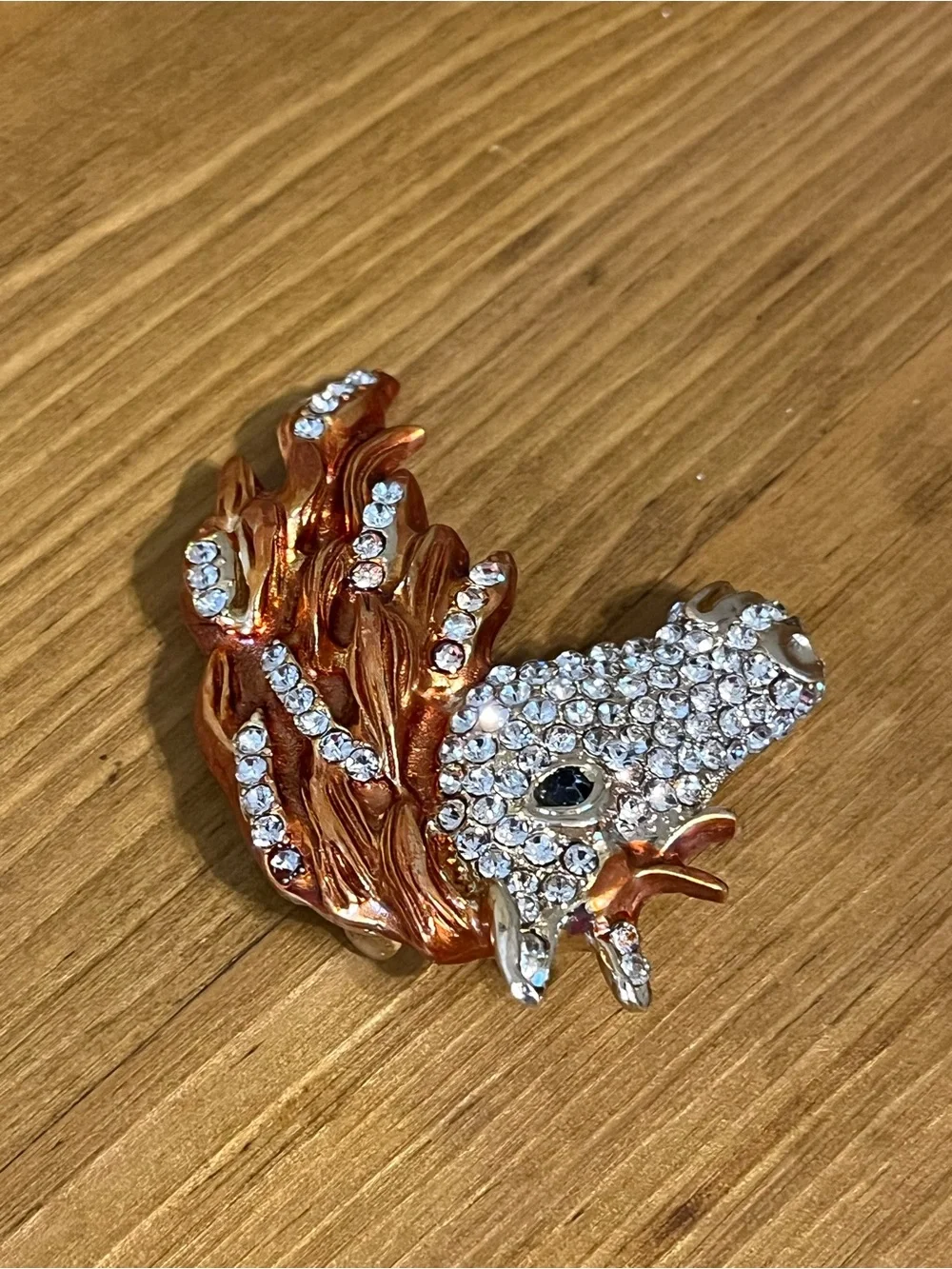 None this brooch